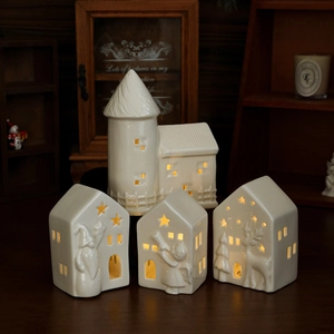 Ceramic LED Christmas village set with white glazed houses and hollow star patterns
