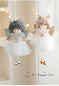 Detail of plush Christmas angel dolls with mesh skirts and glitter wings for tree decor