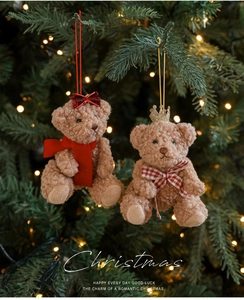 Detailed close-up of brown plush teddy bear ornaments with festive Christmas accessories