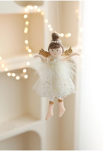 Detail of angel plush ornament with white mesh skirt and golden wings for Christmas