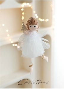 Detail of Christmas angel plush doll featuring white mesh skirt and golden star wand