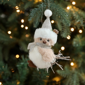Gray plush bird Christmas tree ornament with silver sequin hat and scarf on pine branch