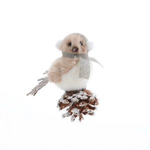 Plush grey bird ornament with mini earmuffs and scarf perched on a snowy pinecone