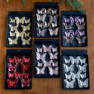 Farfalle decorative glitterate per l'albero di Natale in colori assortiti su legno