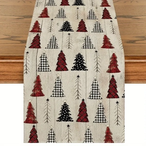 Detail of linen Christmas table runner featuring red plaid and polka dot tree patterns