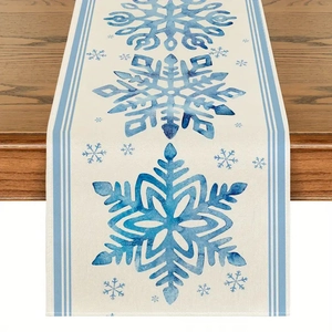 Detailed weave of linen Christmas table runner featuring blue watercolor snowflakes