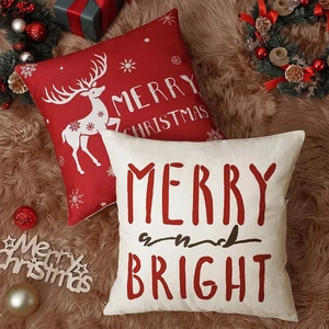 Set of Christmas pillow covers with red reindeer and festive text on cozy faux fur rug