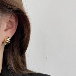 925 silver French style croissant gold hoop earrings with ribbed texture on model