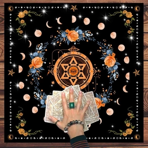 Close-up of tarot altar cloth with mandalas, moon phases, and mystical floral symbols