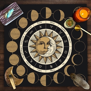 Macro detail of black altar cloth featuring golden sun, moon and zodiac signs