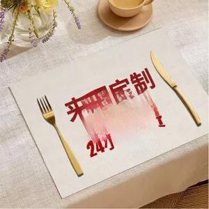 Close-up of beige linen placemat texture with gold cutlery for elegant dining table decor