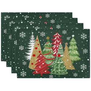 Set of 4 linen Christmas table mats featuring green forest trees and white snowflakes