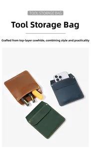 Detail of genuine cowhide leather tool holsters with snap buttons for mobile phones and tools