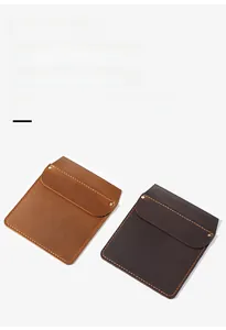 Detailed view of handmade crazy horse leather pocket organizer with vintage metal buttons