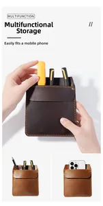 Detailed view of leather pocket organizer showing compartments for phone and tools