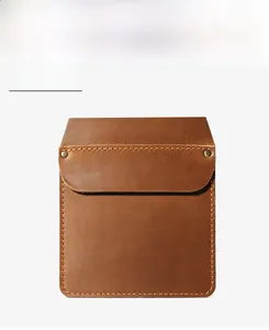 Close-up of vintage brown leather pocket holster with rivet reinforcement and fine stitching