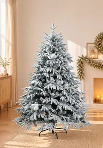 Detail of high-density flocked Christmas tree with realistic snow effect and warm LED lights