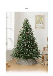Close-up of frosted Christmas tree with red berries, pine cones and grey woven tree base