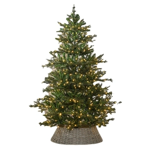 Realistic artificial Christmas tree with warm white LED lights and woven wicker tree collar