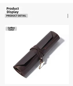 Detail of coffee brown genuine leather roll case with vintage bronze key pendant