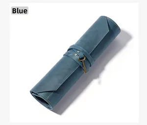 Blue retro leather roll-up pencil pouch with a vintage key pendant and strap