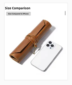Brown leather roll-up tool pouch size comparison with a smartphone on white background