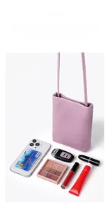 Detail view of purple lychee grain leather phone bag showing large interior capacity