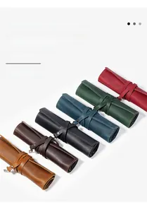 Showcase of six vintage crazy horse leather pencil rolls in various rich colors