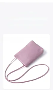 Close-up of lavender leather texture on a minimalist crossbody mobile phone bag