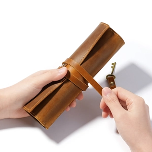 Vintage crazy horse leather pencil roll wrap with brown leather strap and key charm