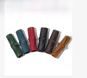 Selection of six vintage crazy horse leather roll-up pencil cases in various rich colors