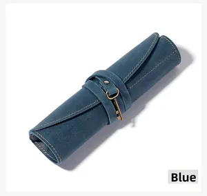 Blue vintage crazy horse leather pencil roll wrap with a key charm and contrast stitching
