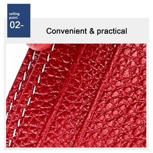 Detail of red leather texture with white double-line stitching on a card holder wallet