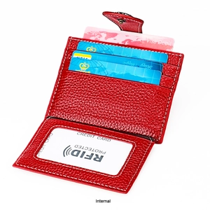 Detail view of red leather wallet with RFID blocking slots and secure snap closure