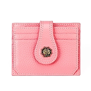 Detail of pink lychee leather card holder with gold rose clasp and white stitching