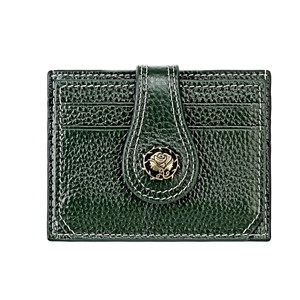 Detail of dark green pebble leather card holder with gold rose clasp and contrast stitching