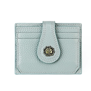 Detail of light blue lychee texture leather card holder with rose metal buckle