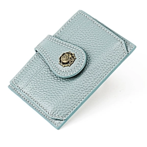 Detail of grey-blue pebble leather card holder with vintage rose metal clasp and stitching