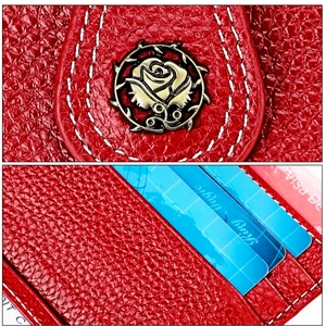 Close-up of red lychee pattern leather wallet featuring a vintage metal rose buckle and card slots