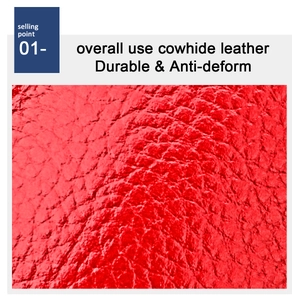 Detail of red cowhide leather showing natural grain and durable material texture