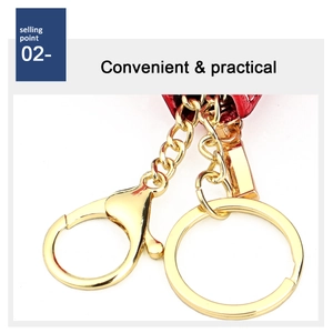 Macro detail of golden metal key ring and lobster clasp on red leather coin purse