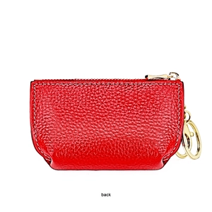 Detail view of the red leather coin purse back with lychee texture and gold keychain