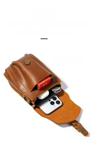 Detail of crazy horse leather waist bag showing two compartments for phone and accessories