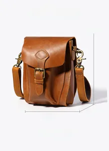 Side view detail of a vintage crazy horse leather crossbody bag showing dimensions 14x7x20cm