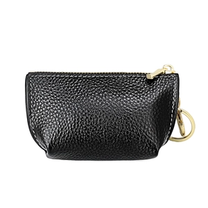 Detailed close-up of black pebbled leather coin purse with white contrast stitching
