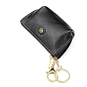 Close-up of black litchi grain leather key pouch with golden rose metal emblem