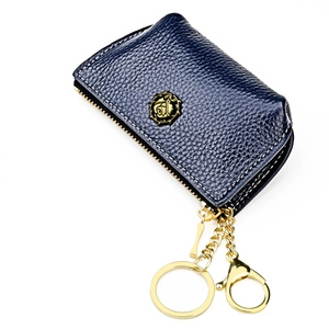 Close-up of a blue lychee leather coin purse with golden rose logo and white stitching