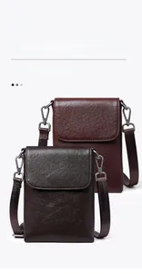 Detail of vegetable tanned leather phone bags showing flap design and texture