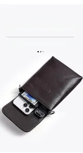 Deep brown vegetable tanned leather phone bag with magnetic flap and metal hardware detail
