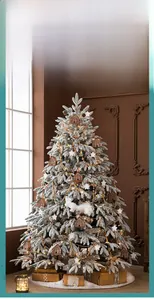 Detailed close-up of a flocked Christmas tree with warm LED lights and woodland ornaments